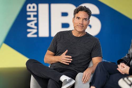 Cesar Contreras speaking on stage at an industry event